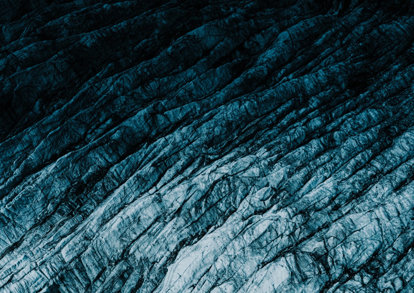 Glacier ice close-up — blue abstract texture.